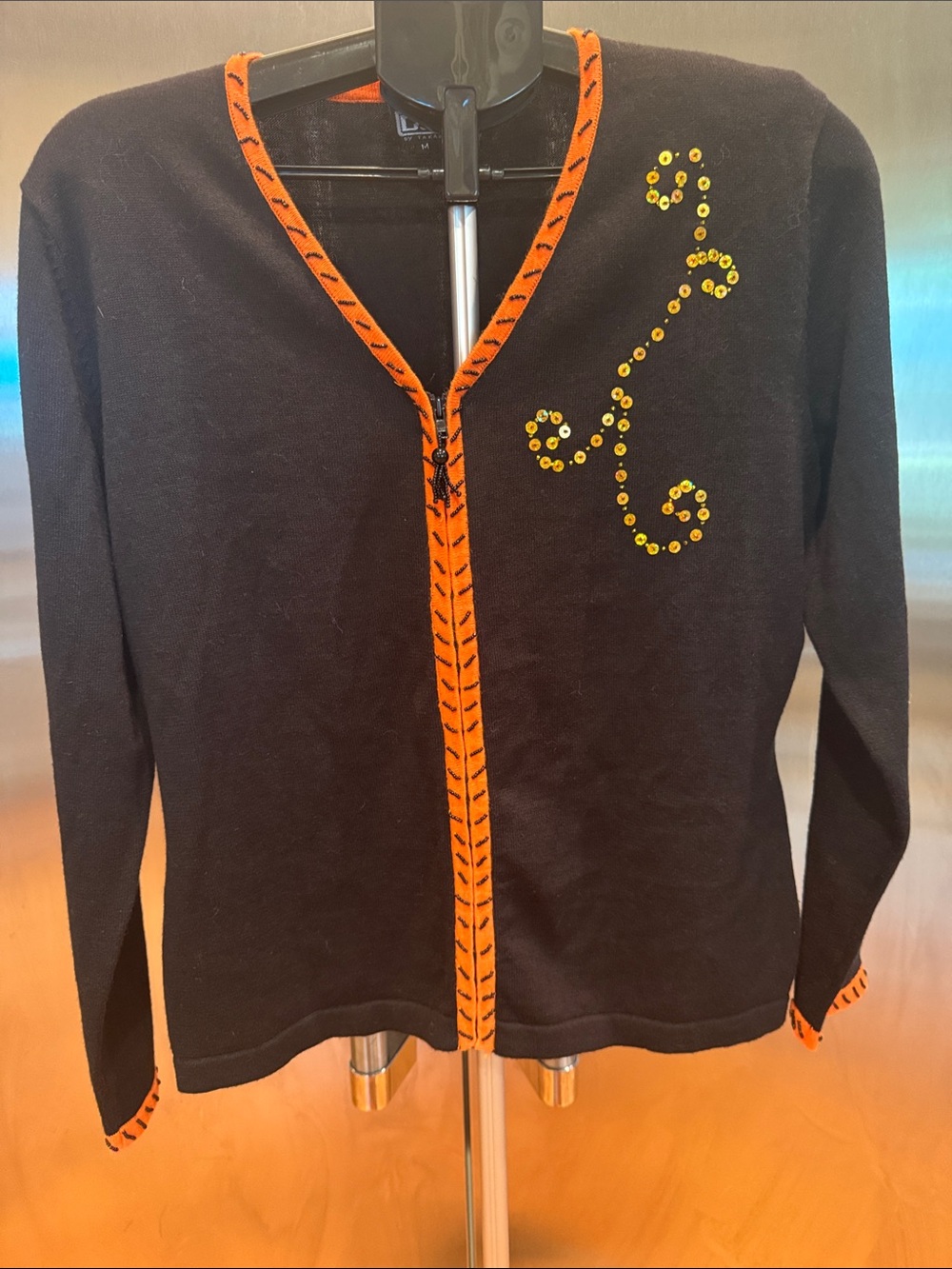 Black Cardigan with Orange Trim and Yellow Sequin Swirl